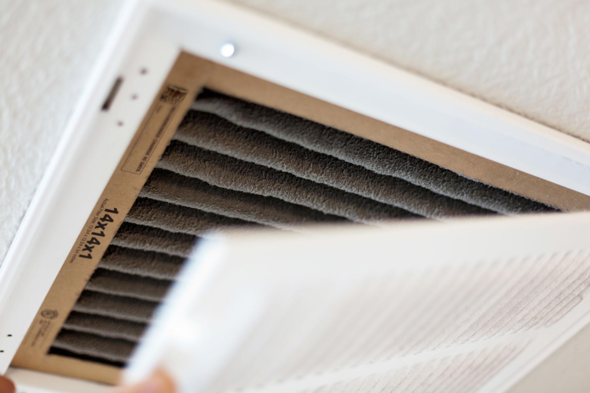 Clogged HVAC air filter that restricts airflow and reduces cooling efficiency.