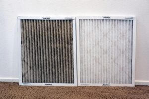 Dirty HVAC air filter compared with a clean replacement filter for better airflow