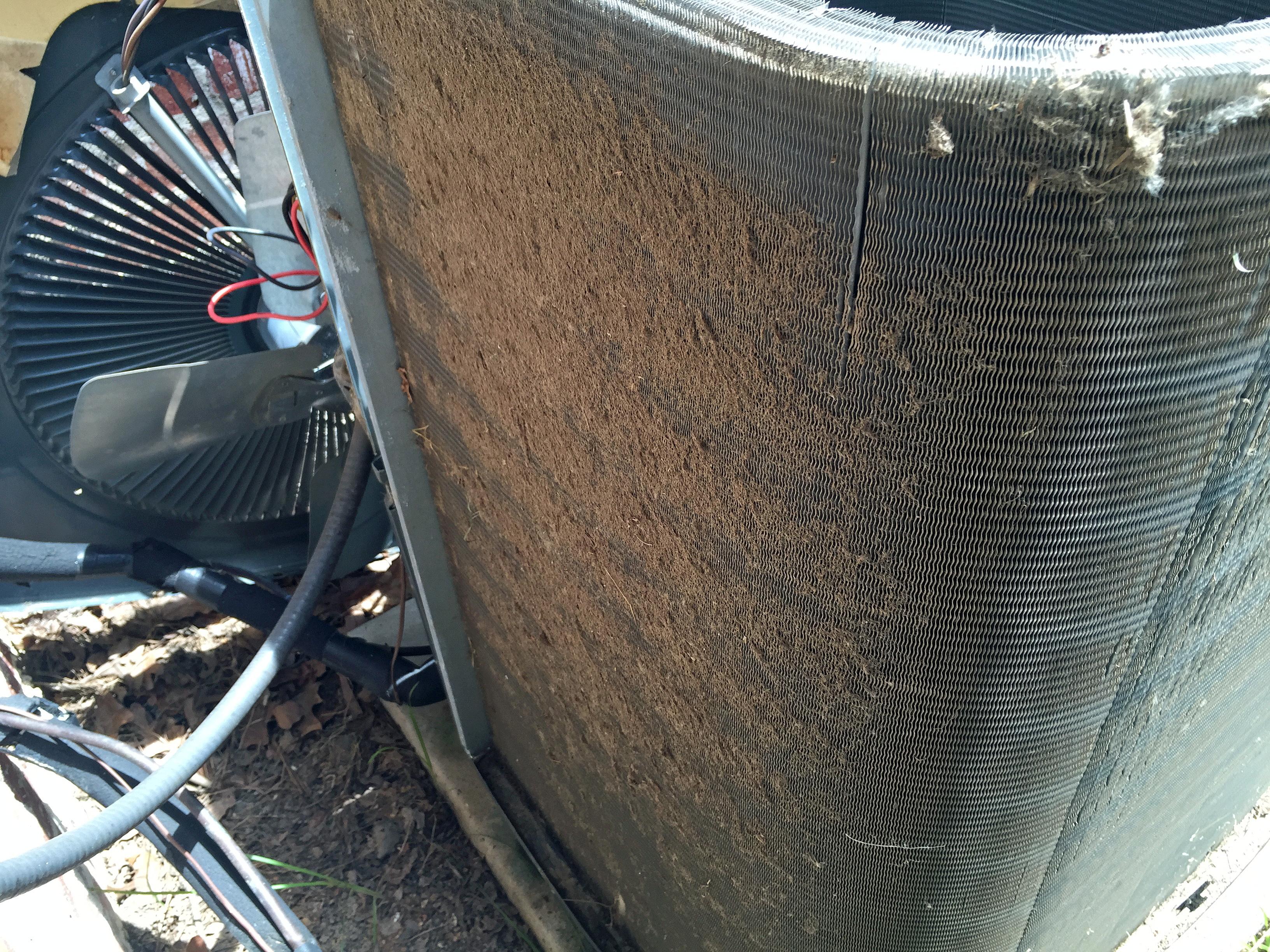 Aging air conditioner showing wear that can reduce cooling efficiency