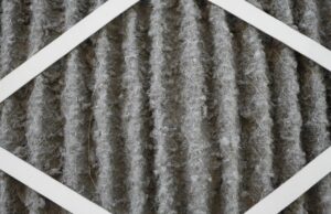 Dirty HVAC air filter clogged with dust and indoor allergens