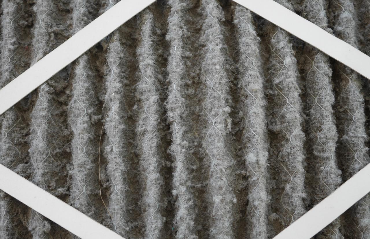 Dirty HVAC air filter clogged with dust and indoor allergens