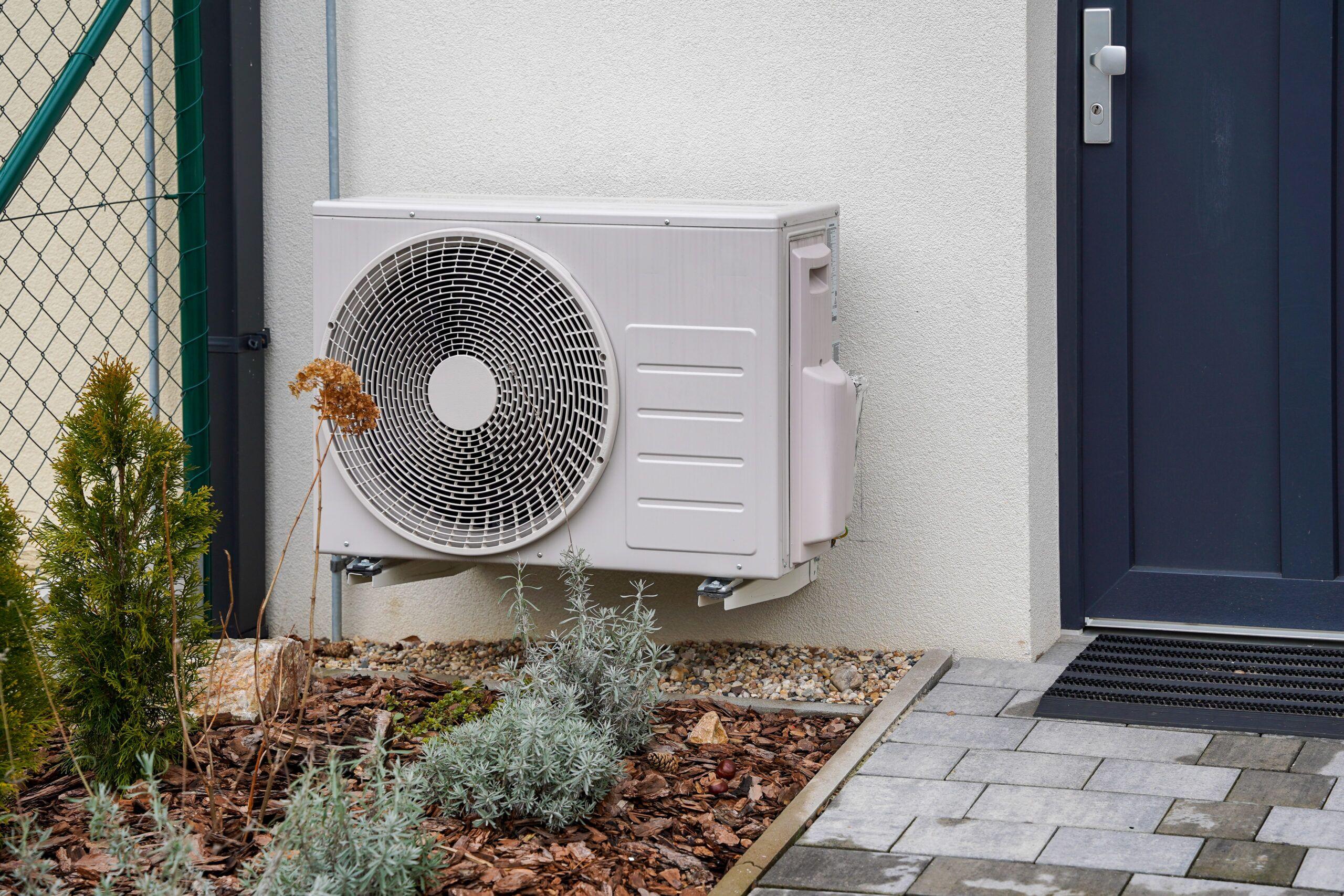 New energy efficient residential AC system replacing an older air conditioner