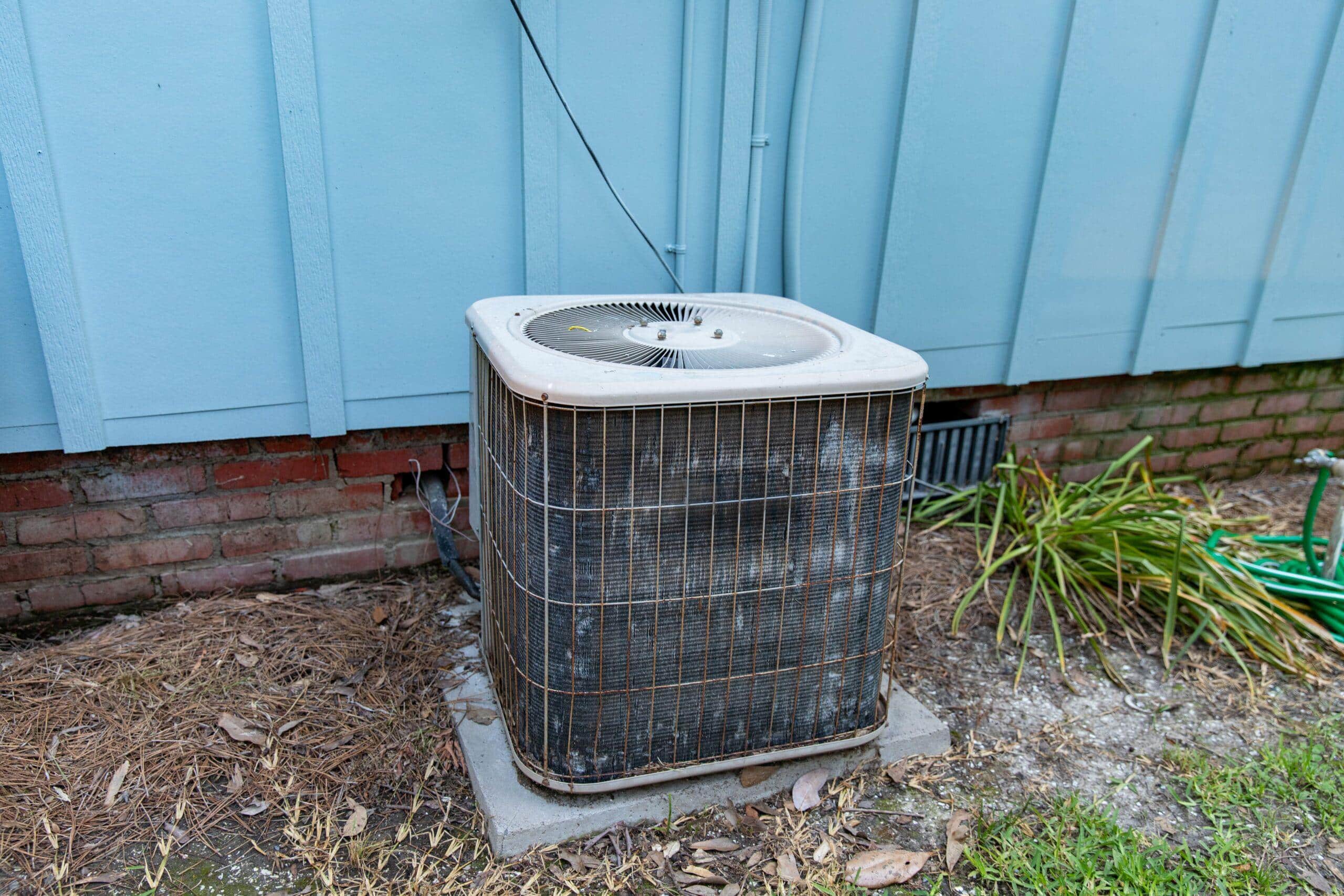 Aging AC unit with worn components requiring costly repairs